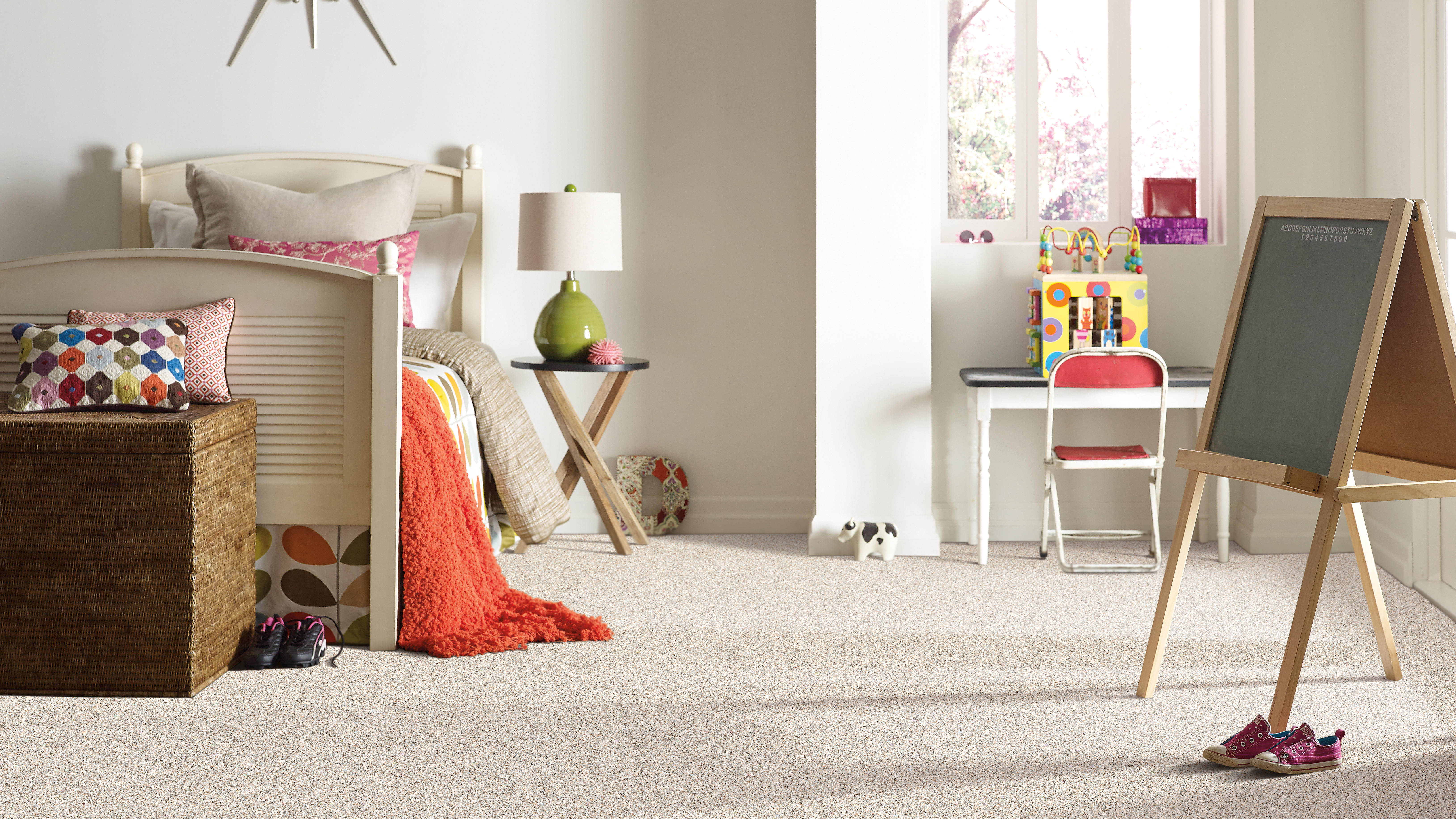 Beautiful cream colored carpet within a child's bedroom 