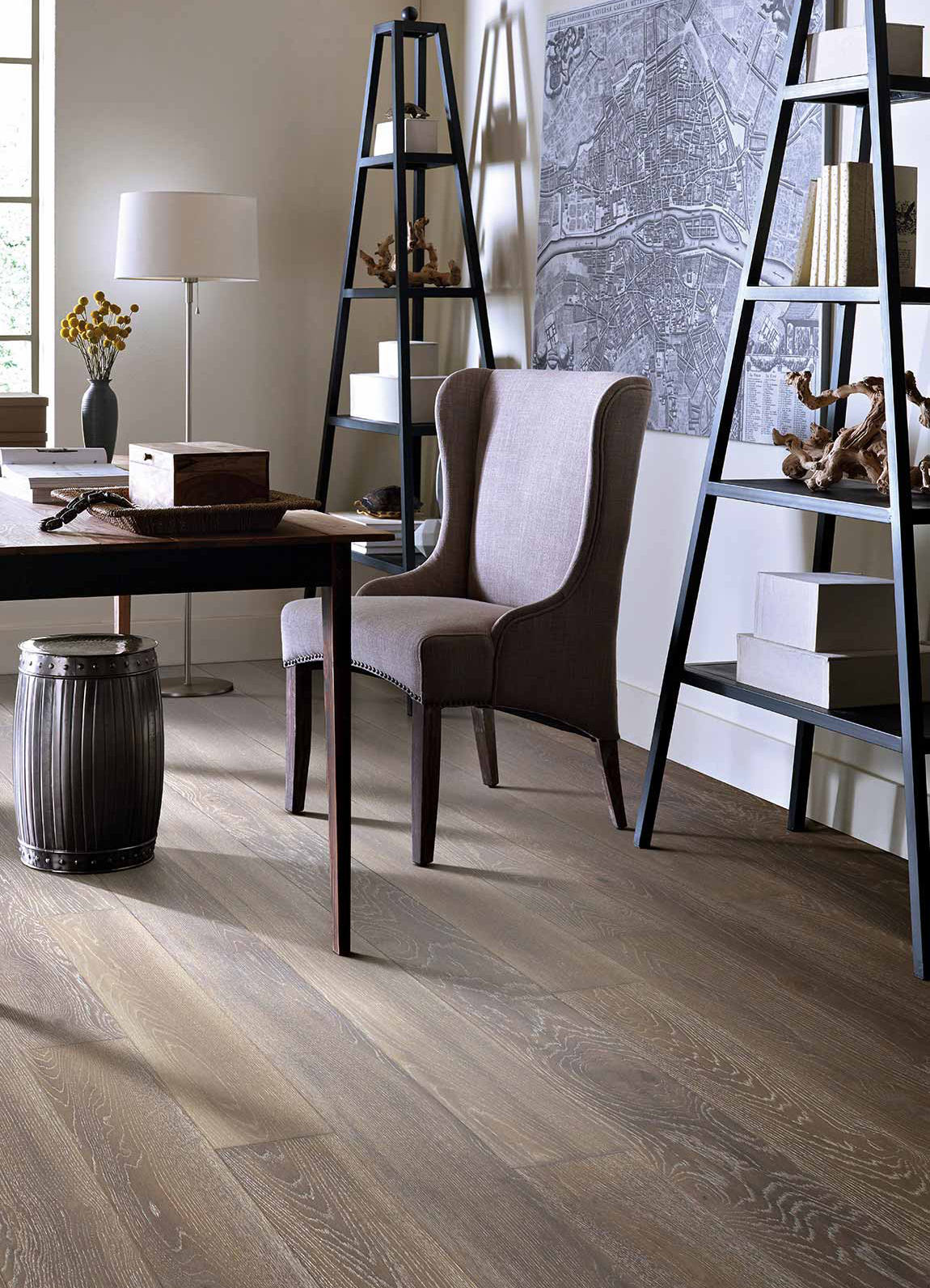 Brown chair at a desk with hardwood flooring underneath 