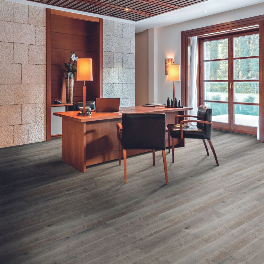 office with dark flooring, wood desk, window, and black wooden chairs