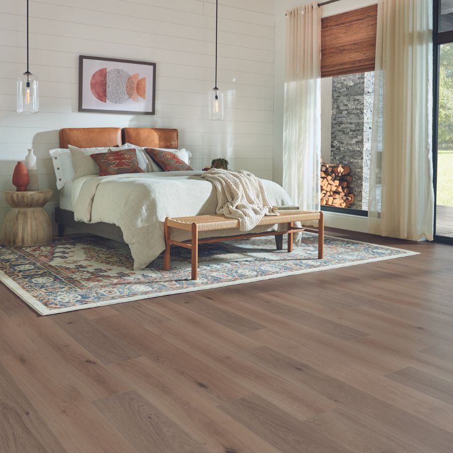 Bedroom, laminate flooring, windows, white walls, wall art